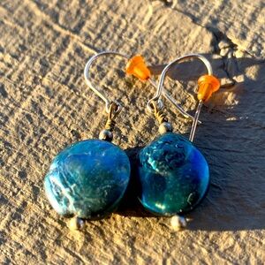 Iridescent Blue freshwater pearl earrings on silver wire.